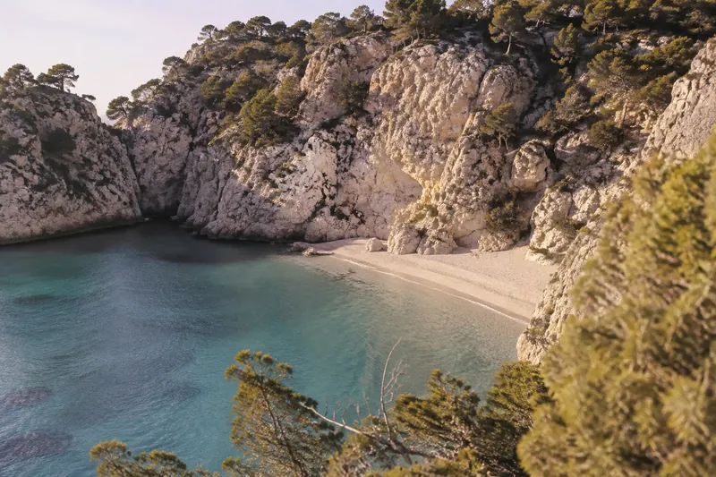 A hidden Mediterranean beach between soaring cliffs